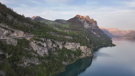Lake-Walensee-Cliffside-at-Dusk,-Switzerland-landscape---aerial