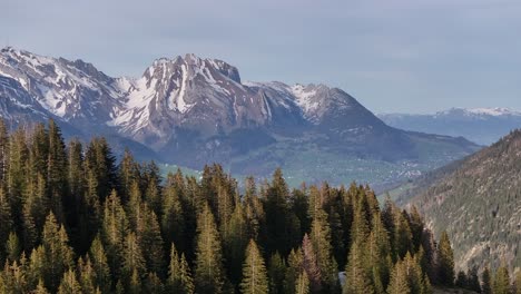 The-serene-beauty-of-Amden-Sentis-Schweiz,-with-mesmerizing-drone-footage-revealing-snowy-mountains,-tall-trees