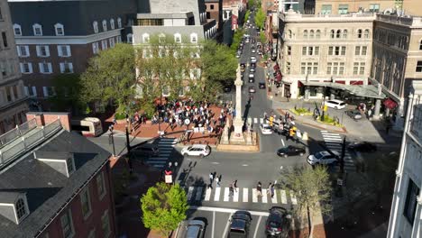 Aerial-approaching-shot-of-traffic-on-Junction-in-american-town-during-demonstration-in-the-evening