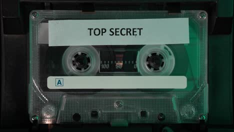 Playing-Cassette-Tape-With-Top-Secret-Audio-Recording,-Close-Up
