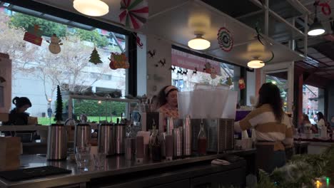 Coffee-barista-at-Grand-Central-Market-in-Downtown-Los-Angeles-preparing-drinks