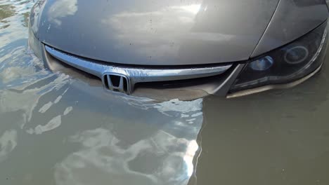 A-vehicle-submerged-in-floodwaters-post-record-rainfall-in-the-UAE-on-April-2024