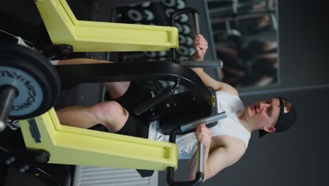 Vertical-shot-of-person-at-gym-do-back-training-with-low-row-machine