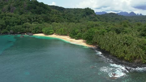 Aerial-view-of-paradise-beach-in-Principe-Island,-turquoise-colored-waters