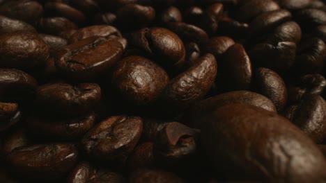 Macro-slow-motion-dolly-slide-of-roasted-coffee-beans