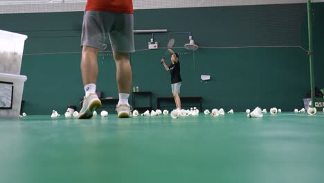 Bangkok,-Thailand---Mar-27,-2024:-An-Asian-child-girl-is-learning-badminton-individually-with-a-coach-in-the-gym