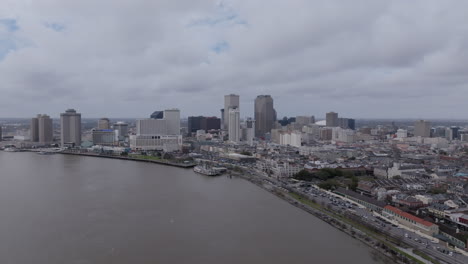 Aerial-footage-flying-over-the-Mississippi-River-towards-downtown-New-Orleans-on-a-cloudy-day