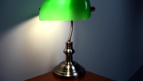 Green-Reading-Lamp-on-the-brown-desk