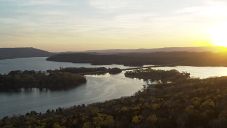 Aerial-footage-of-Nickajack-Lake-in-Tennessee-during-the-sunset-with-highway-I-24-cutting-through-the-lake-and-boats-on-the-water