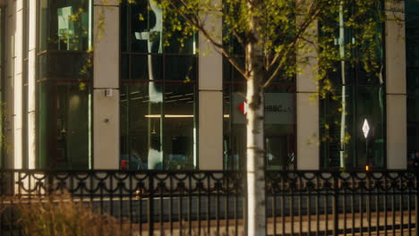 A-static-shot-of-commuters-and-employees-walking-past-HSBC’s-Birmingham-HQ-on-a-sunny-morning