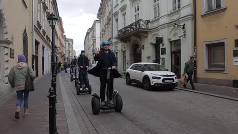 Tourists-explore-the-historic-city-of-Krakow-on-Segways