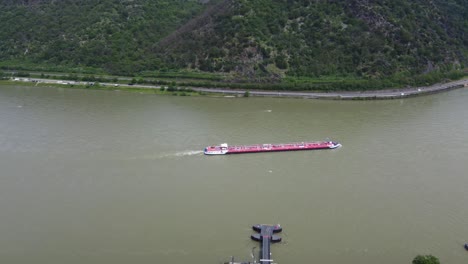 Bulk-Tanker-Barge-traveling-upstream-on-River-Rhine-in-Germany,-Drone-Tracking