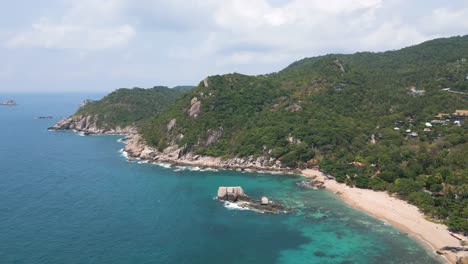Slow-drone-push-out-over-beautiful-beach-on-tropical-Thai-Island