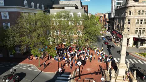 Demonstration-on-square-of-american-town-during-golden-sunset