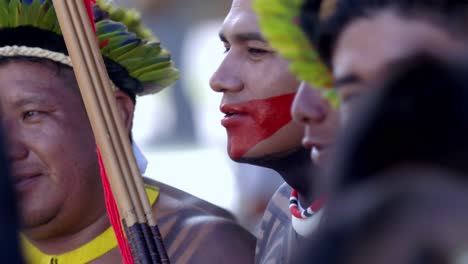 Slow-motion-shot-of-indigenous-Amazon-men-with-headdresses-dancing-at-the-COP-30-march