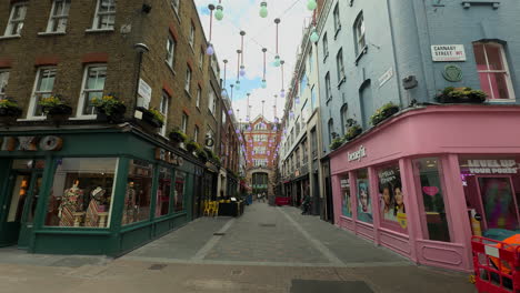 Wide-angle-of-junction-of-Carnaby-Street-and-Ganton-Street,-Soho,-London,-Day