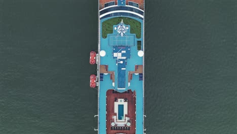 Aerial-view-of-cruise-ship-deck-sailing-in-Babitonga-Bay,-Brazil