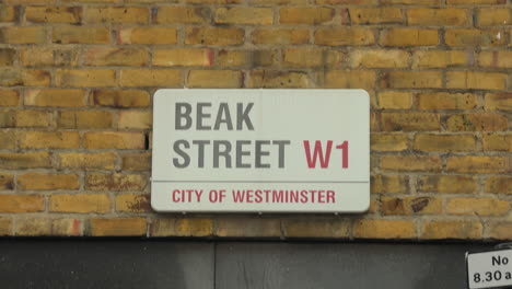 Close-up-of-Beak-Street-road-sign,-Soho,-London,-Day