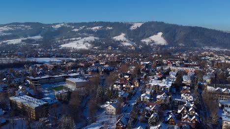 Aerial-view-of-snowy-town-of-Zakopane,-Poland-in-winter-time