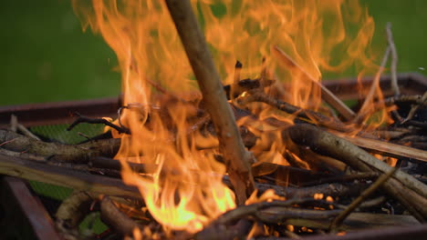 Slow-mo-close-up-of-a-fire-being-agitated-by-a-stick