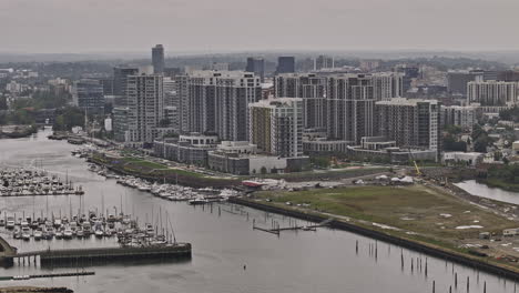 Stamford-Connecticut-Aerial-v5-zoomed-flyover-Waterside-area-capturing-apartment-buildings-situated-along-Long-Island-Sound-with-boats-docked-at-the-marina---Shot-with-Mavic-3-Pro-Cine---October-2023