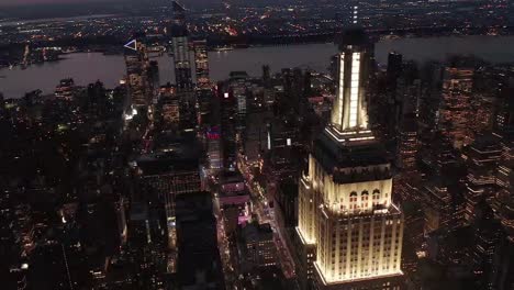 Aerial-view-of-Empire-state-building-flying-over-parallel-avenues-and-junctions-4k-drone-shot