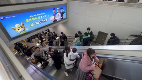 Commuters-On-The-Escalators-In-Tokyo-Train-Station-In-Japan