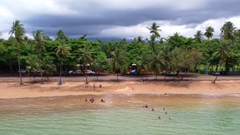 Flying-backward-revealing-Natural-landscape-of-São-Tomé-e-Principe-Island,-Lush-vegetation-and-scenic-beach