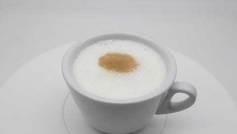 Italian-Cappuccino-on-rotating-display-isolated-on-white-background