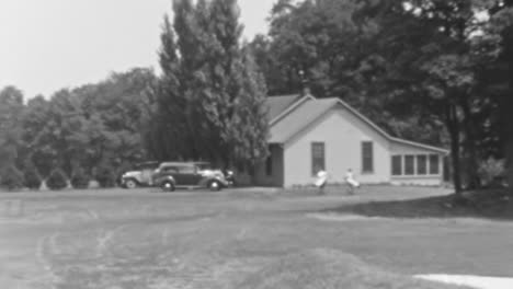 Panoramic-View-of-Golfers-Along-a-Golf-Club-in-Vintage-Footage