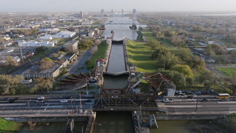 Aerial-flyover-footage-of-a-series-of-locks-in-a-small-river-in-New-Orleans,-Louisiana