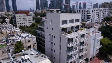 Drone-shot-of-buildings-and-settlement-around-Bublick-Street-in-the-city-of-Tel-Aviv,-Israel