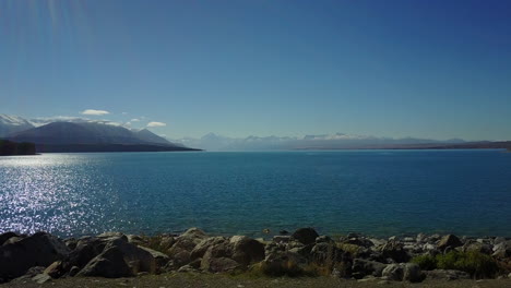 Drone-lands-on-shore-of-Lake-Pukaki-with-Mount-Cook-in-the-distance