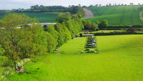 Aerial-lowering-to-Upper-Parsonage-farm-camping-Sunny-day-UK-4K