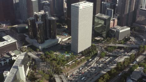 Aerial-view-of-Union-bank-plaza,-skyscraper-in-los-angeles,-california-busy-highway-drone-shot-4k