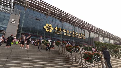 Visitors-taking-rest-on-the-stairs-of-China-import-and-export-fair-complex-at-the-end-of-the-day