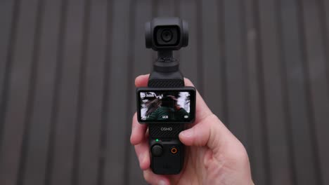 Hand-Pressing-5D-Joystick-Of-DJI-Osmo-Pocket-To-Rotate-Camera
