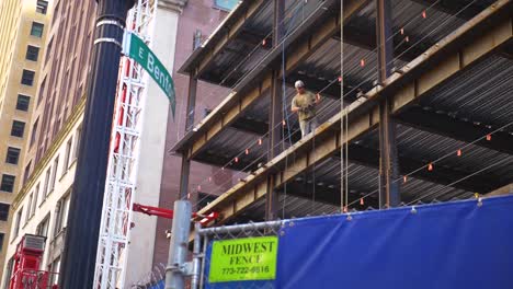 Man-building-out-the-second-floor-of-a-building