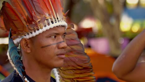 A-young-indigenous-Amazon-man-wearing-a-feathered-headdress-at-the-COP-30-march