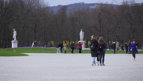 Landscape-and-sculptures-in-the-garden-of-Schönbrunn-Palace-in-Vienna,-cloudy-and-cold-afternoon