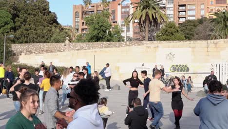 people-dance-to-music-in-the-streets-of-Valencia,-Spain