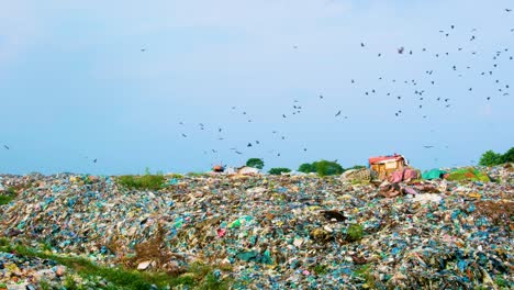 Heap-Of-Trashes-And-Rubbish-In-Polluted-Landscape-With-Flying-Birds