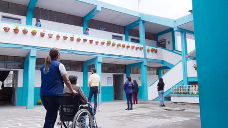 general-moving-shot-of-disabled-people-voting