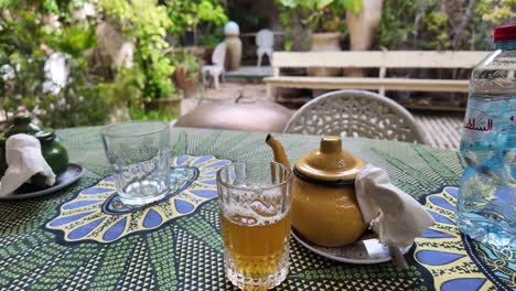 Authentic-Moroccan-mint-loose-leaf-tea-in-teapot-at-touristic-restaurant-in-Fes