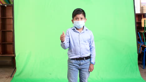 general-shot-of-child-with-mask-with-green-background