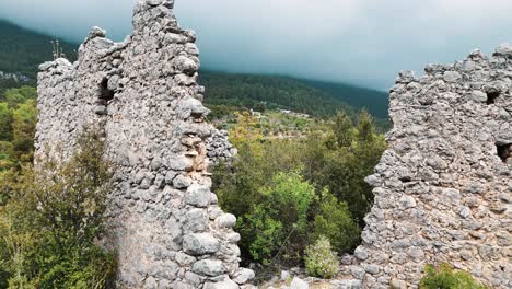 Aerial-View-of-the-Ruins-of-the-Ancient-Roman-Kadrema-Castle-Located-in-the-Gedelme-Village-and-Mountain-Ridge-on-Background