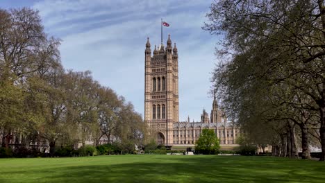 Victoria-Tower-At-The-Westminster-Palace-Seen-From-Victoria-Tower-Gardens-South-Park-In-London,-United-Kingdom