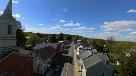 Houses,-shops,-and-church-lining-town-street