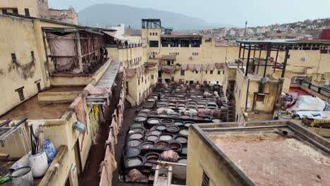 Moroccan-Chouara-Tannery-in-Fes,-treating-animal-leather-manual-labour