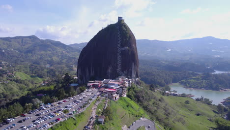 El-Penol,-La-Piedra-Rock-in-Guatape-Region-Landscape,-Aerial-View-of-Landmark,-Hills-and-Lake-on-Sunny-Day,-Colombia